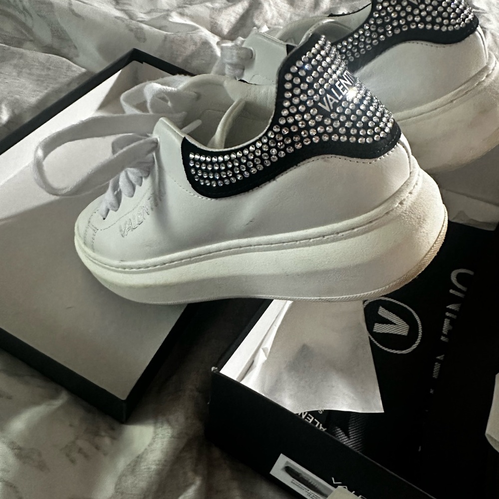 Valentino Black and White sneakers with rhinestone detail.